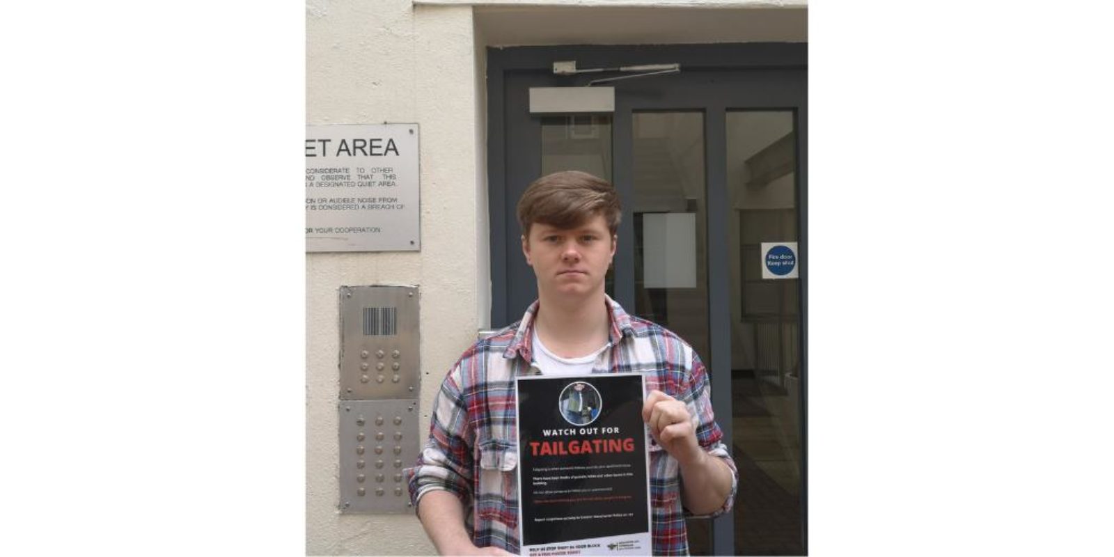 Cllr Jon-Connor Lyons with anti-tailgating poster